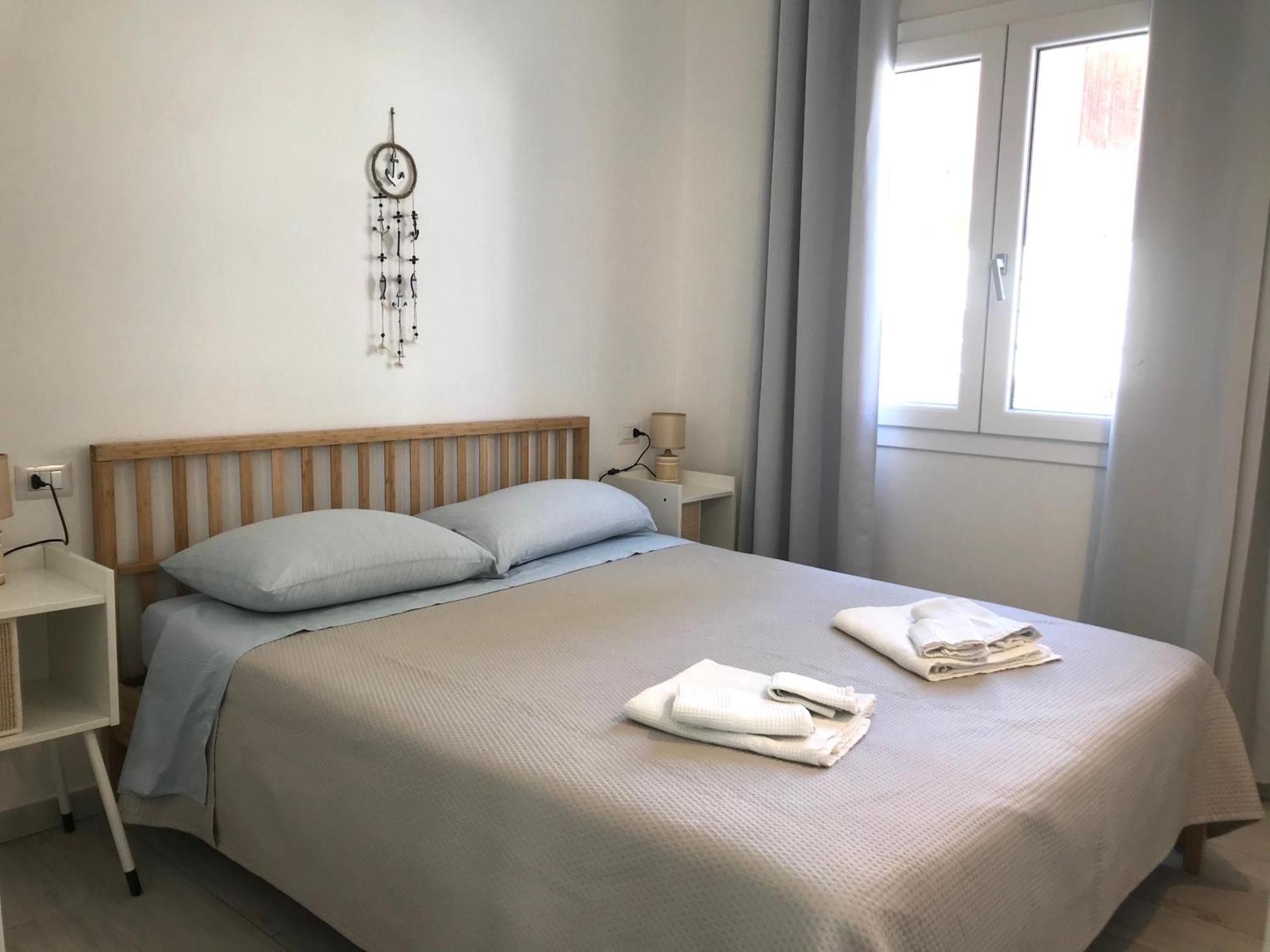 Case Vacanze "Bianco Mare" Porto Pino Szoba fotó