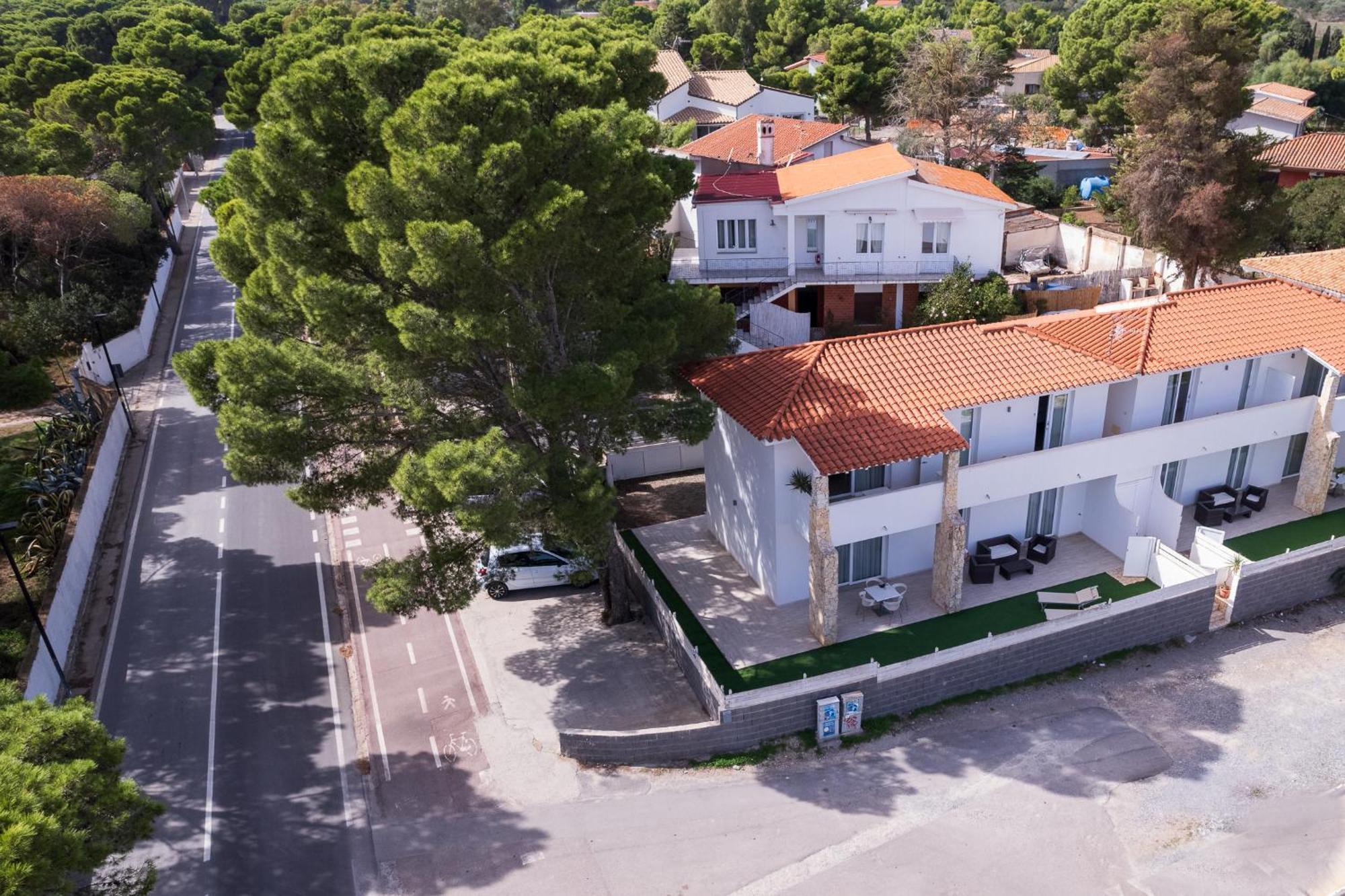Case Vacanze "Bianco Mare" Porto Pino Kültér fotó