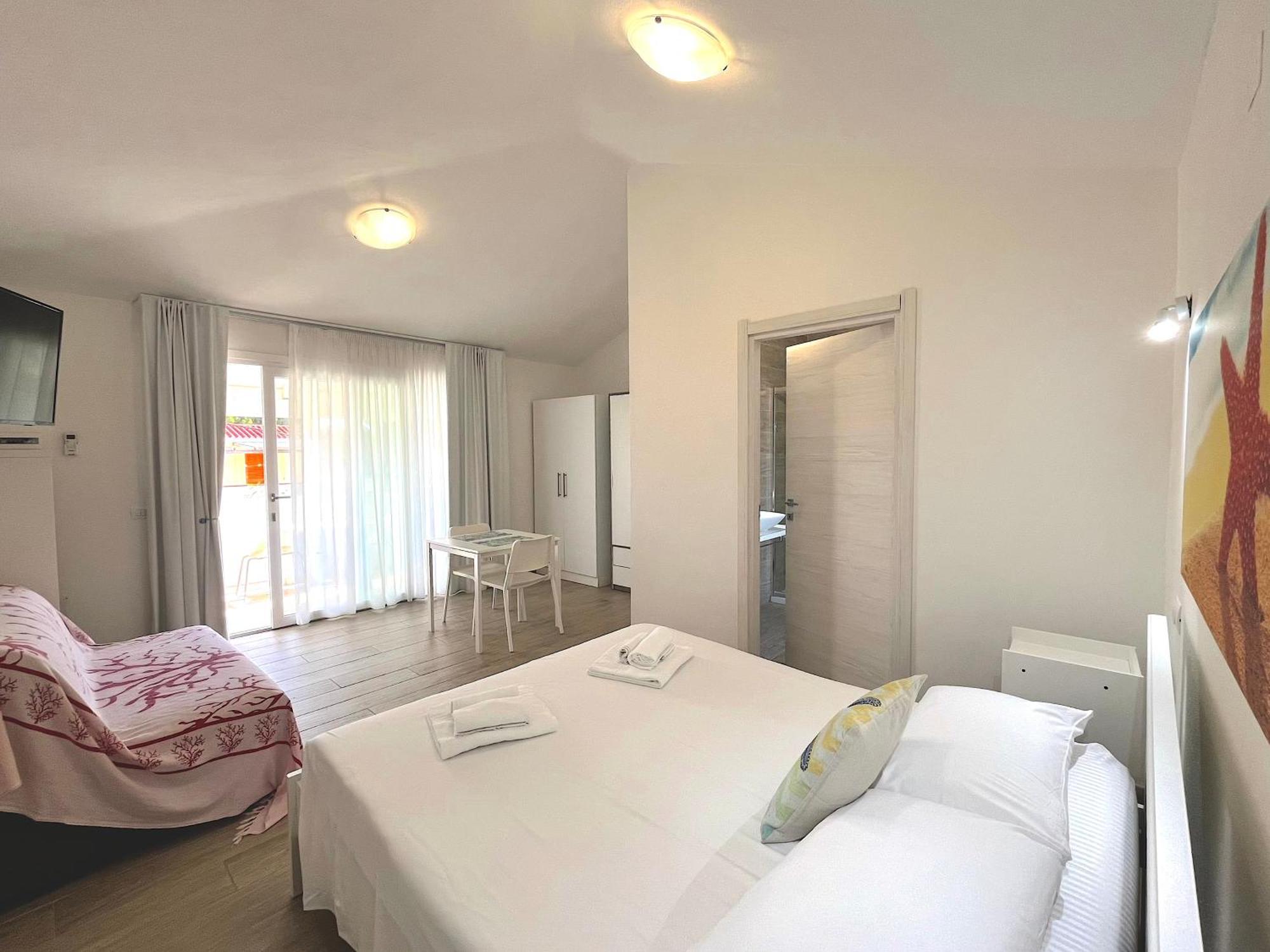 Case Vacanze "Bianco Mare" Porto Pino Szoba fotó